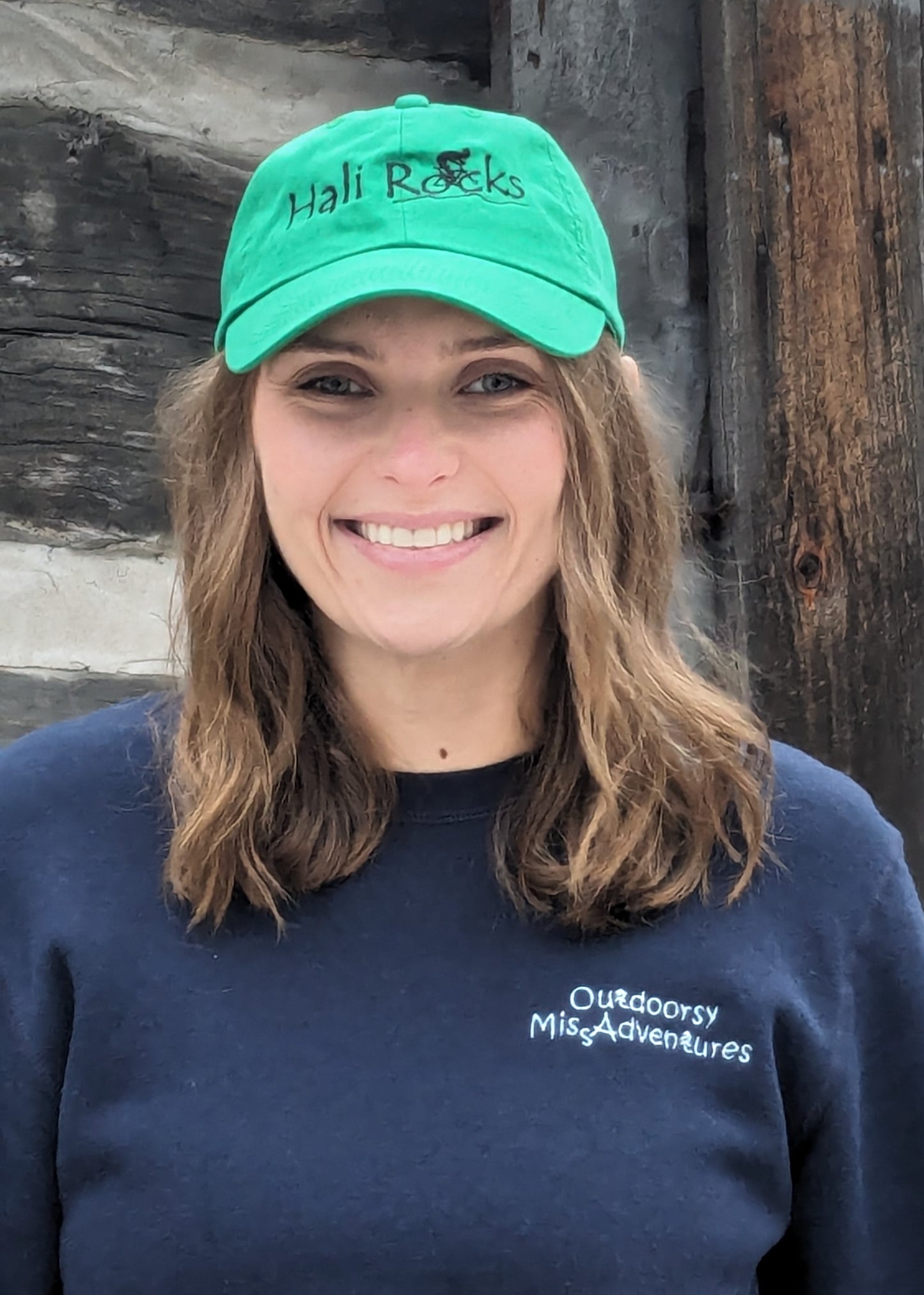 Small Town Natural model is wearing Hali Rocks Mtb Hat 100% Cotton regular curved peak colour = kelly green Embroidery = Black with cyclist climbing rocky trail