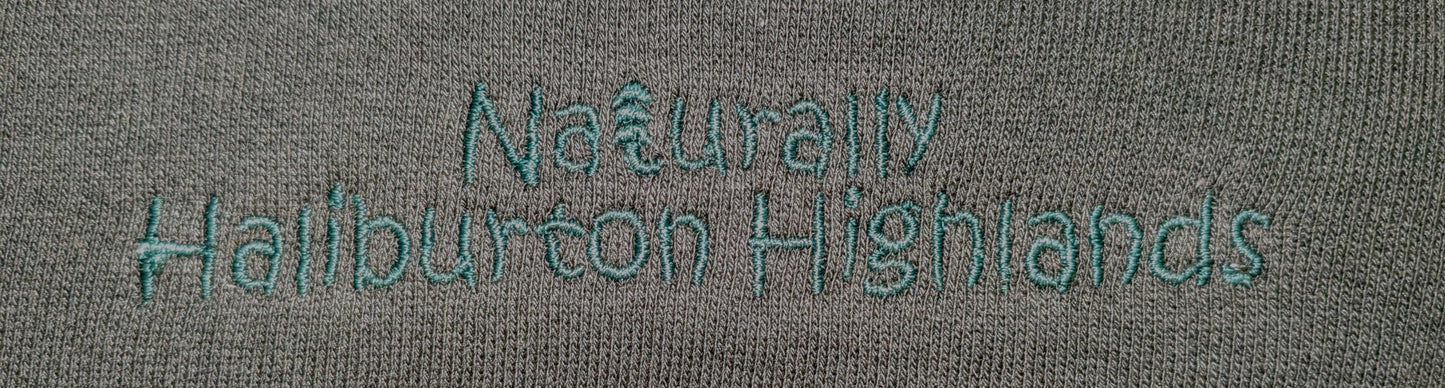 close up of forest green embroidery on sweatshirt Naturally Haliburton Highlands Three End Bamboo Fleece Crew Neck Sweatshirt colour= forest green 70% bamboo 30% cotton